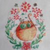 finished embroidery of cross stitch artwork with floral ginger cat surrounded by colorful flowers and soft decorative details