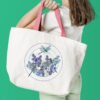 Woman with white tote bag Lavender dragonfly cross stitch pattern - stitched mock up on tote bag