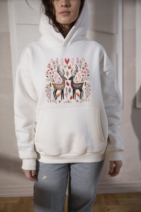 100 Romantic deer cross stitch design displayed on pullover