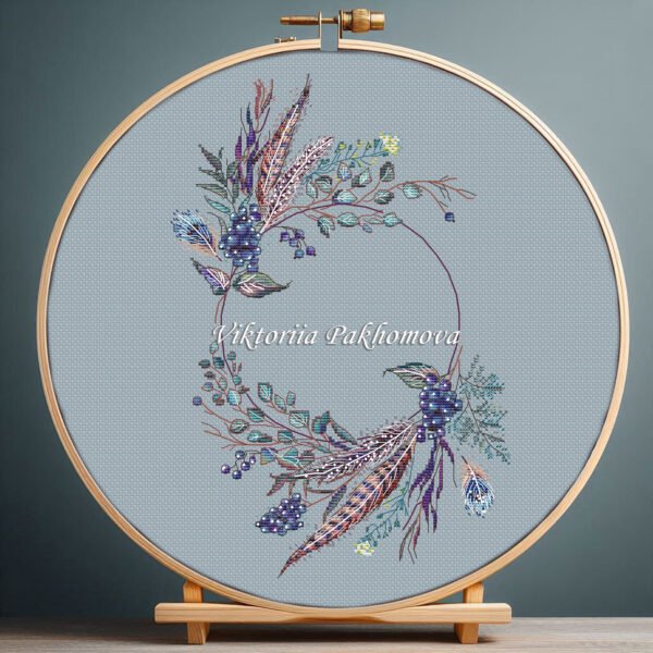 Boho wedding wreath cross stitch pattern with blue florals in embroidery hoop