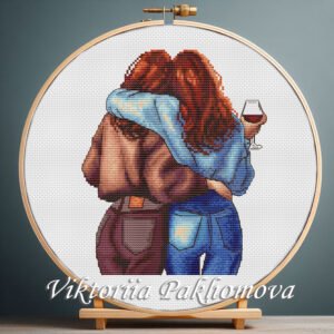 Girls hugging cross stitch pattern in embroidery hoop — cozy female design