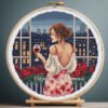 131 Woman on balcony with night city cross stitch pattern — romantic evening design
