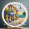 Colorful Cyprus summer landscape cross stitch pattern in an embroidery hoop,