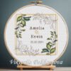 131 Personalized wedding wreath cross stitch pattern with floral frame, couple names, and wedding date in embroidery hoop