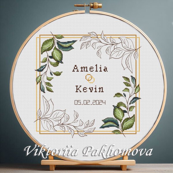 131 Personalized wedding wreath cross stitch pattern with floral frame, couple names, and wedding date in embroidery hoop