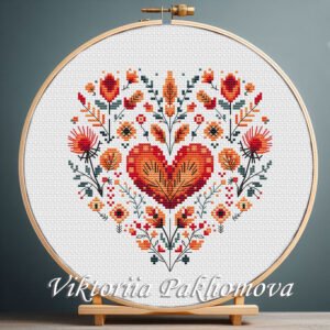 131 Floral Heart cross stitch pattern displayed in a wooden embroidery hoop with Scandinavian folk motifs