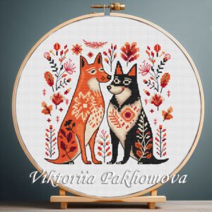 Romantic Dogs cross stitch pattern displayed in a wooden embroidery hoop with warm folk‑art flowers