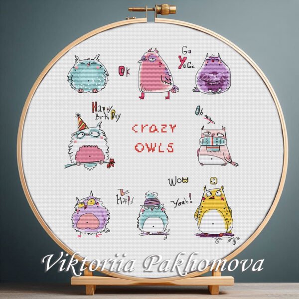 131 Crazy Owl cross stitch pattern bundle displayed in a wooden embroidery hoop with bright pastel colors