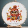 131 Autumn Owl cross stitch pattern displayed in a wooden embroidery hoop with bright fall colors