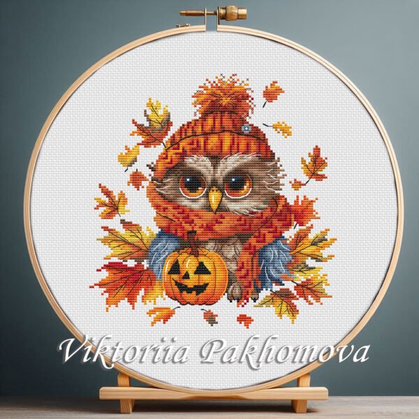131 Autumn Owl cross stitch pattern displayed in a wooden embroidery hoop with bright fall colors