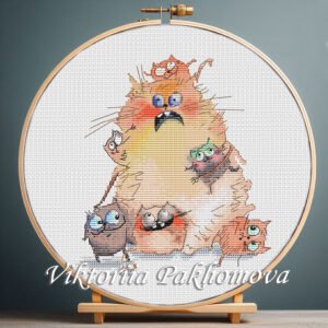 Cross stitch embroidery of a large ginger cat surrounded by playful kittens in bright colors, displayed in a wooden hoop