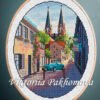 Neuruppin Germany cross stitch pattern with European cityscape and blue car in embroidery hoop