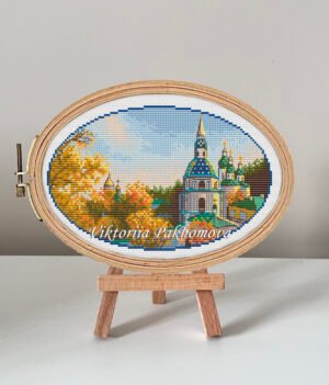 Vydubytskyi Monastery cross stitch pattern in embroidery hoop, colorful Kyiv autumn landscape
