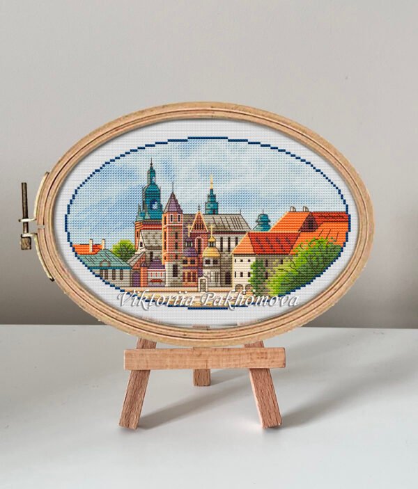 Krakow castle cross stitch pattern in embroidery hoop, colorful European cityscape design
