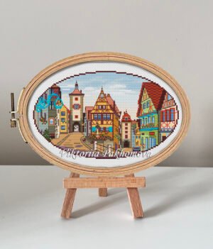 132 Rothenburg Germany cross stitch pattern in embroidery hoop, colorful medieval European town design