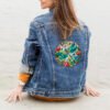 137 Dragonfly stained glass cross stitch design stitched on denim jacket mockup