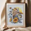 Framed tawny owl and sunflower cross stitch artwork with soft moon background, nature embroidery
