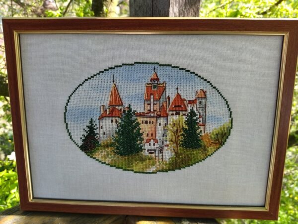 185047339_290219956114405_5312977458100005788_n Framed Dracula Castle cross stitch artwork with European towers and forest landscape