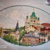 Kyiv Andriyivskyi Descent cross stitch displayed with cozy decor, colorful summer city embroidery