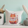 Mockup pillow in the children's room on light blue colors wall b Romantic cat cross stitch design displayed on decorative pillow