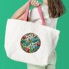 Woman with white tote bag Dragonfly stained glass cross stitch design stitched on tote bag