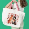 Romantic dogs cross stitch design displayed on tote bag