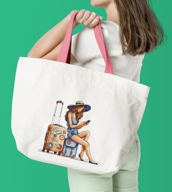 Travel girl embroidery on tote bag — cross stitch design preview