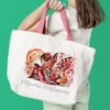 Woman with white tote bag Elf girl and fox cross stitch design stitched on tote bag