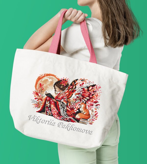 Woman with white tote bag Elf girl and fox cross stitch design stitched on tote bag