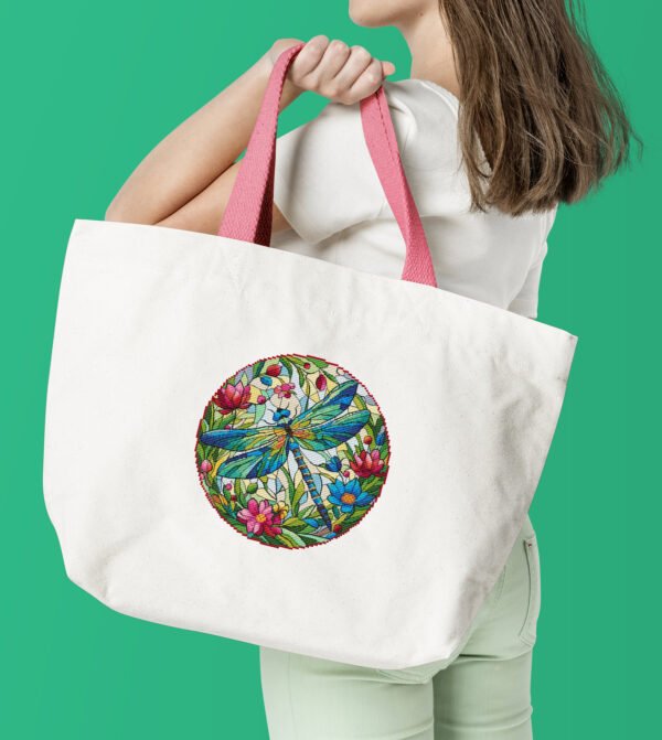 Woman with white tote bag Dragonfly stained glass cross stitch design stitched on tote bag