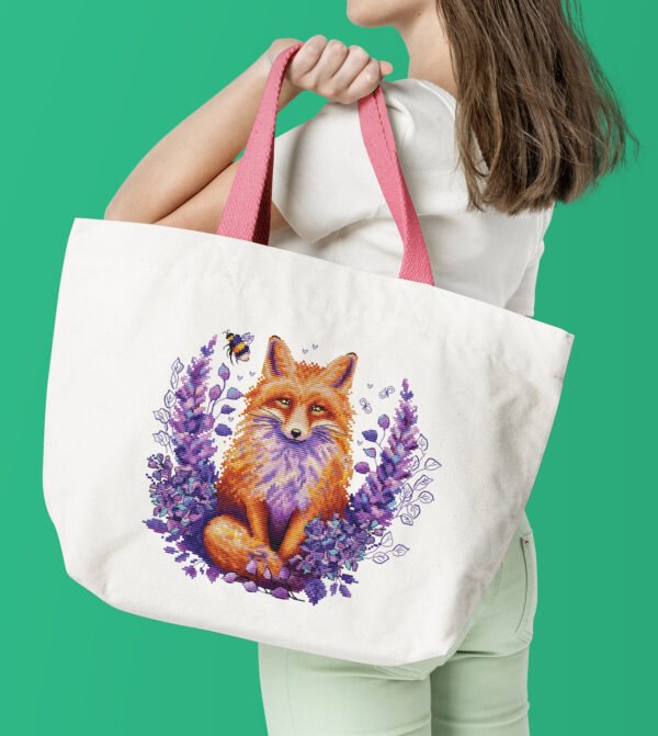 Woman with white tote bag Fox in lavender cross stitch design displayed on tote bag