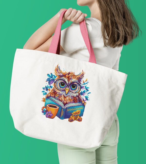 Tote bag with whimsical owl cross stitch design featuring a book, tea cup and bright foliage, artistic owl illustration