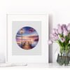 422 Breaking Dawn cross stitch pattern framed, colorful sunrise coastal scene with pier, lamp and glowing sky, embroidery design by Viktoriia Pakhomova