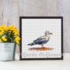whimsical seagull cross stitch design framed