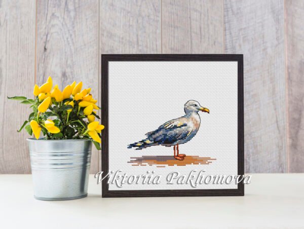 whimsical seagull cross stitch design framed