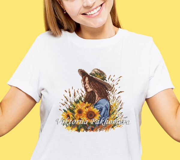 Girl with sunflower cross stitch design stitched on T-shirt