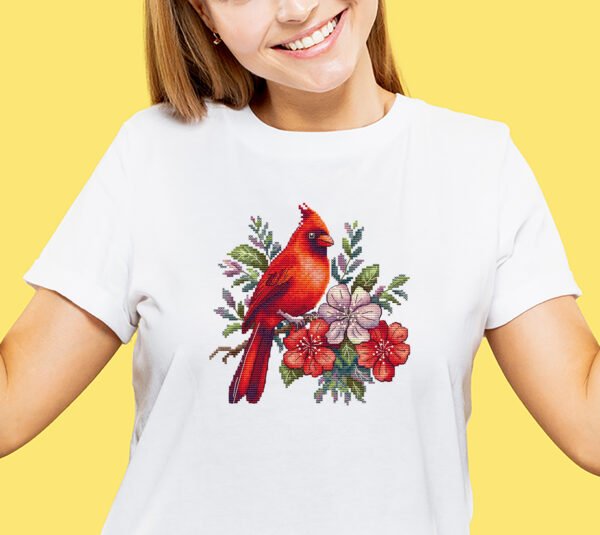 Caucasian young woman's half-length portrait on yellow background Floral cardinal cross stitch design stitched on T-shirt