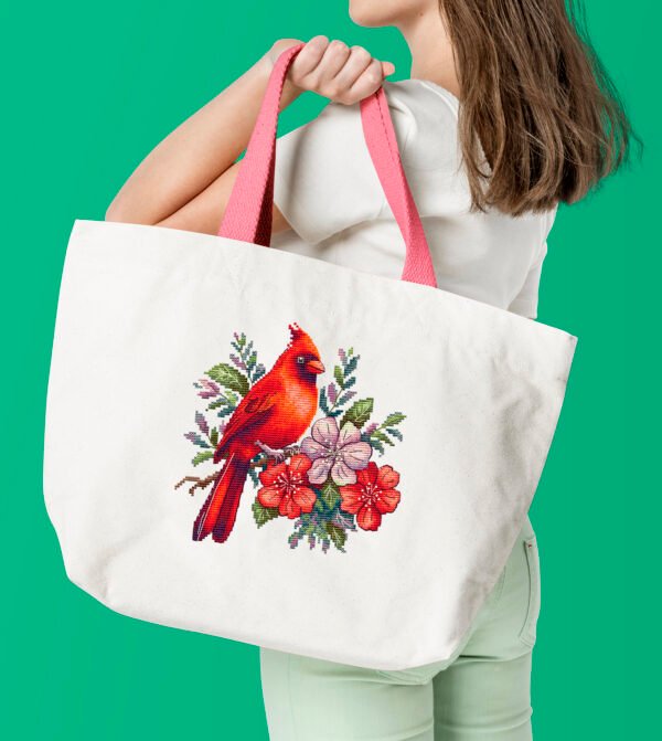 Woman with white tote bag Floral cardinal cross stitch design stitched on Tote bag