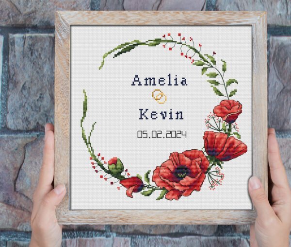 Happy tuesday phrase embedded on grey background Framed poppy wedding wreath cross stitch pattern with personalized couple names and date, elegant red floral keepsake embroidery design