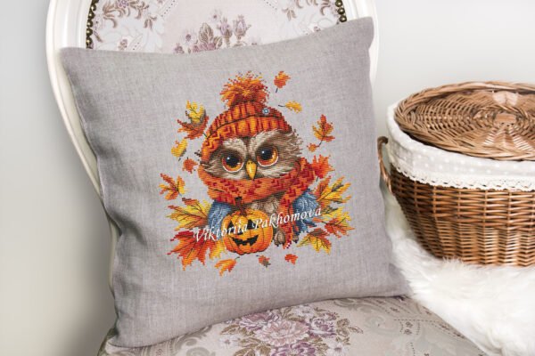 56 Autumn owl cross stitch design displayed on decorative pillow