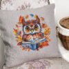 Autumn owl cross stitch design displayed on decorative pillow