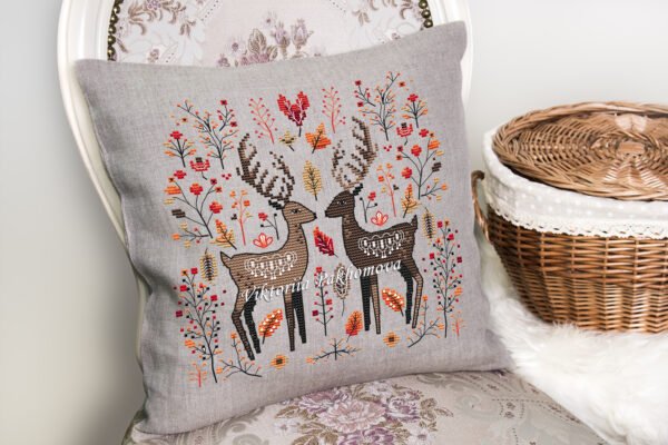 56 Romantic deer cross stitch design displayed on decorative pillow