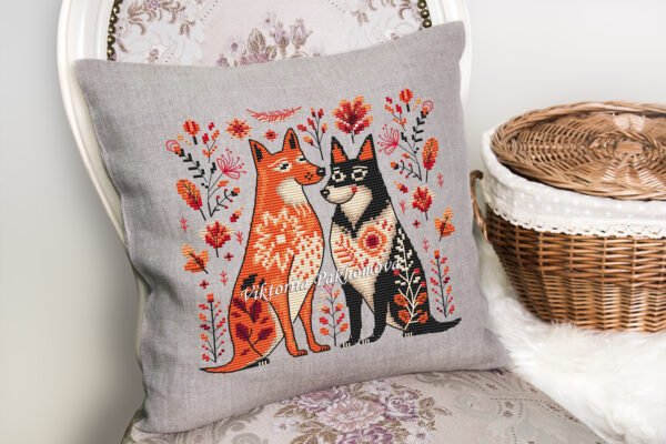 Romantic dogs cross stitch design displayed on decorative pillow