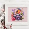 floral camera cross stitch pattern with hummingbird and flowers framed