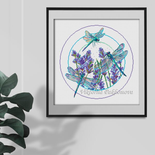 Purple roses psd in a frame hanging on the world mockup Lavender dragonfly cross stitch design stitched and framed