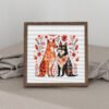 Framed cross stitch artwork of two romantic folk‑art dogs surrounded by Scandinavian floral motifs