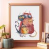 68 Framed cross stitch artwork featuring four bright, playful cats in bold colors with whimsical expressions.