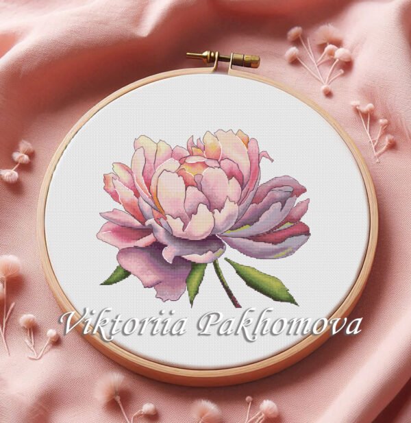 Peony flower cross stitch pattern in embroidery hoop with purple and pink petals