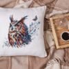 Decorative pillow with mystical owl cross stitch design, cozy autumn home decor embroidery