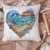 decorative pillow case with heart‑shaped seascape cross stitch pattern with ocean wave and lighthouse